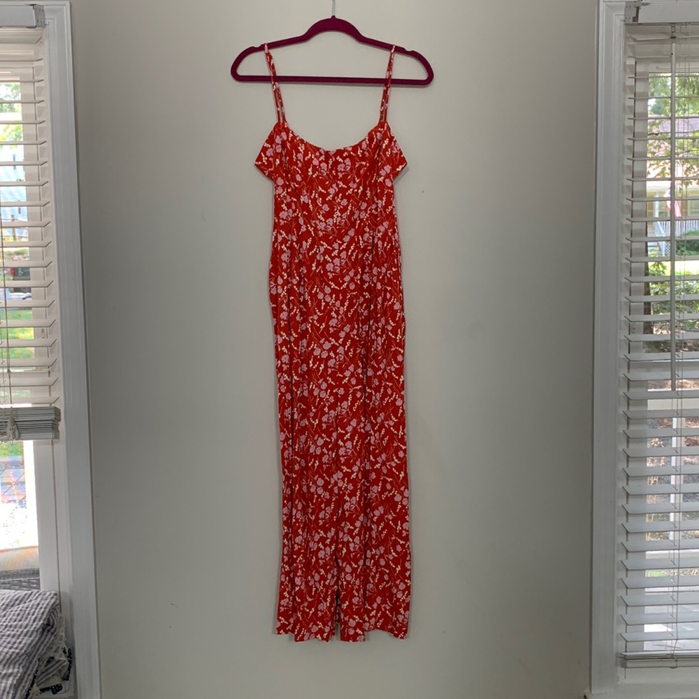 Red and pink flowy Urban Outfitters romper. Loose fit. Pockets. Scooped back.